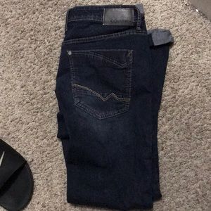 Men’s size 32 waist dark blue straight jeans.